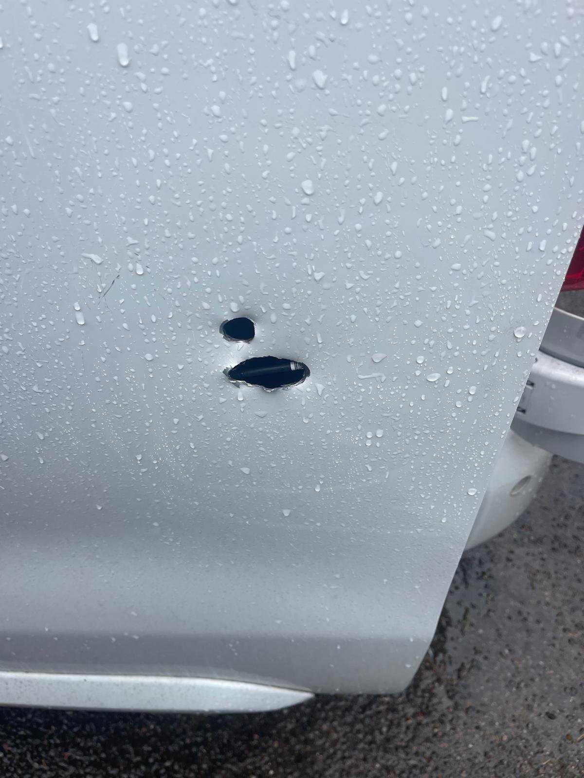 Van side panel drilled and damaged before repair